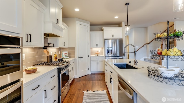 23000 SE Sycamore St, Black Diamond, WA 98010 - kitchen featuring appliances with stainless steel finishes, light countertops, dark wood-style flooring, white cabinets, and recessed lighting