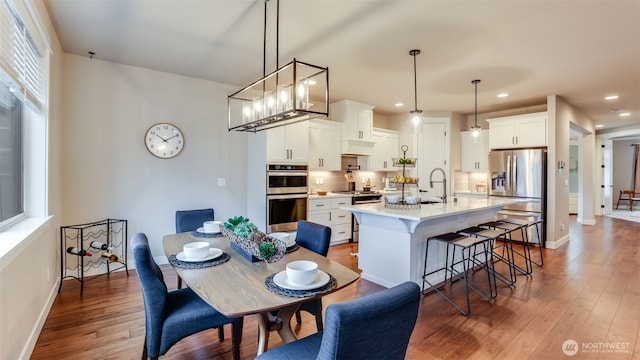 23000 SE Sycamore St, Black Diamond, WA 98010 - dining space featuring recessed lighting, hardwood / wood-style flooring, and healthy amount of natural light