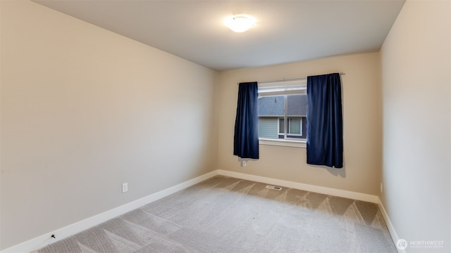 23000 SE Sycamore St, Black Diamond, WA 98010 - carpeted empty room with baseboards