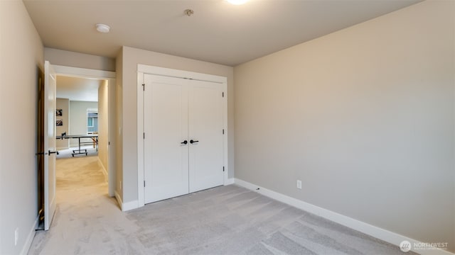 23000 SE Sycamore St, Black Diamond, WA 98010 - unfurnished bedroom featuring light colored carpet and a closet