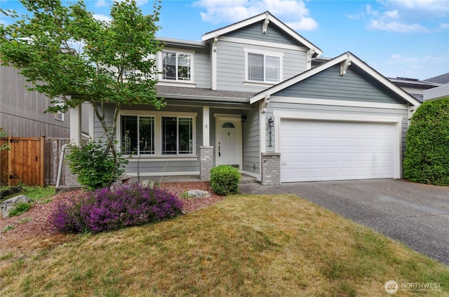 4101 Alabaster St SE, Lacey, WA 98503 - view of front of house with asphalt driveway, a garage, and brick siding