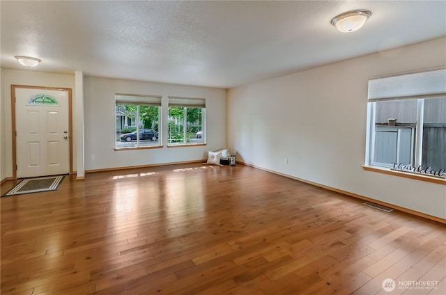 4101 Alabaster St SE, Lacey, WA 98503 - unfurnished room with wood finished floors and a textured ceiling