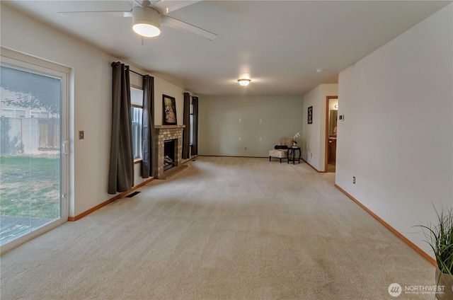 4101 Alabaster St SE, Lacey, WA 98503 - unfurnished living room featuring light colored carpet, healthy amount of natural light, and ceiling fan