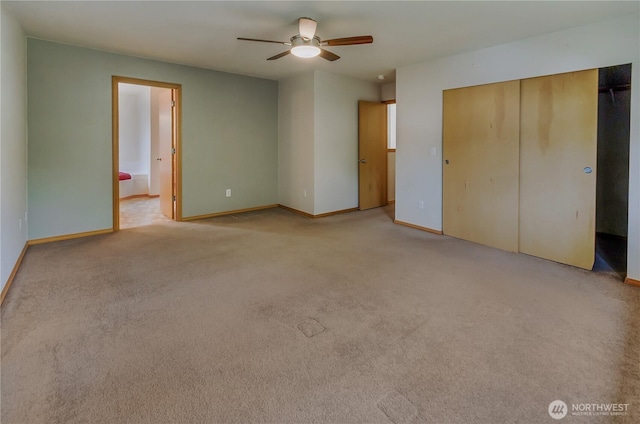 4101 Alabaster St SE, Lacey, WA 98503 - unfurnished bedroom with light colored carpet, a closet, ensuite bath, and a ceiling fan