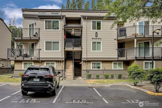 15819 NE Leary Way Unit D302, Redmond, WA 98052 - view of building exterior featuring uncovered parking