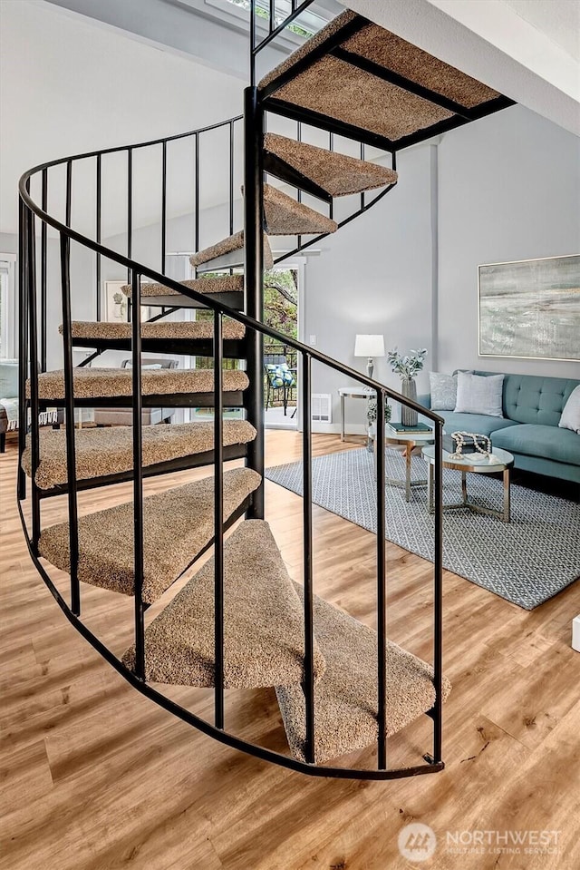 15819 NE Leary Way Unit D302, Redmond, WA 98052 - stairway with wood finished floors and a towering ceiling