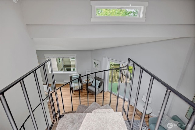 15819 NE Leary Way Unit D302, Redmond, WA 98052 - stairway with wood finished floors, plenty of natural light, and vaulted ceiling