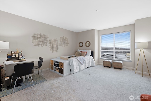 668 S Lane St Unit 603, Seattle, WA 98104 - carpeted bedroom with baseboards and a desk