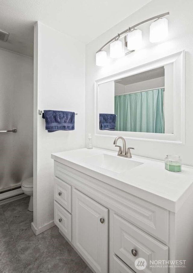 1202 Nelson St, Sedro Woolley, WA 98284 - bathroom with vanity, a baseboard heating unit, and a shower with curtain