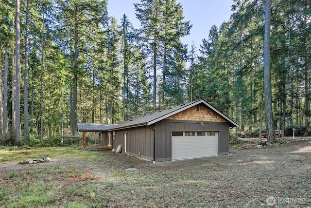 11211 Juniper Pl, Anderson Island, WA 98303 - detached garage featuring a view of trees