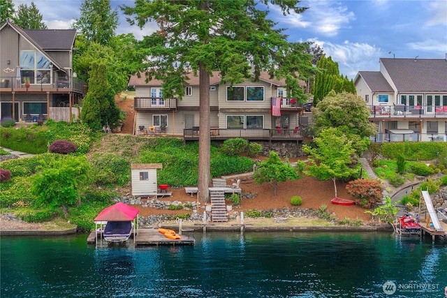 2505 211th Ave E, Lake Tapps, WA 98391 - back of property with a water view, boat lift, and stairs