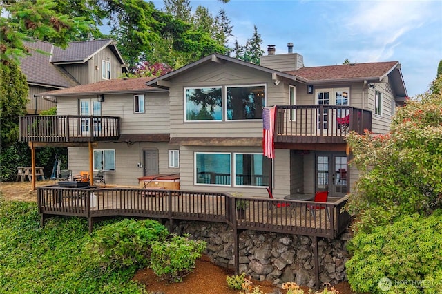 2505 211th Ave E, Lake Tapps, WA 98391 - rear view of house featuring french doors, a deck, and a chimney