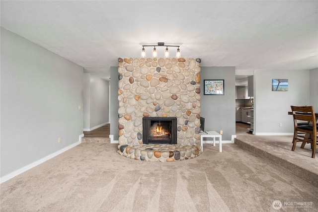 2505 211th Ave E, Lake Tapps, WA 98391 - carpeted living room with a stone fireplace and rail lighting