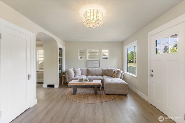 1206 S 14th St, Tacoma, WA 98405 - living area with light wood-style floors and arched walkways