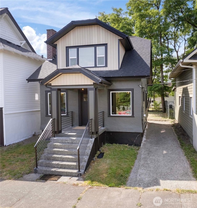 1206 S 14th St, Tacoma, WA 98405 - view of front of house featuring roof with shingles, a chimney, and covered porch