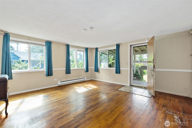 429 170th St S, Spanaway, WA 98387 - unfurnished room featuring a baseboard radiator and hardwood / wood-style floors