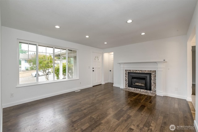 13457 SE Fairwood Blvd, Renton, WA 98058 - unfurnished living room featuring dark wood-style flooring, a tile fireplace, and recessed lighting