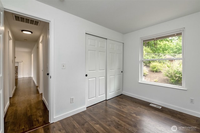 13457 SE Fairwood Blvd, Renton, WA 98058 - unfurnished bedroom with dark wood-type flooring and a closet