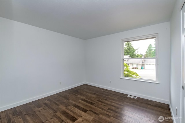 13457 SE Fairwood Blvd, Renton, WA 98058 - spare room with dark wood-style floors and baseboards
