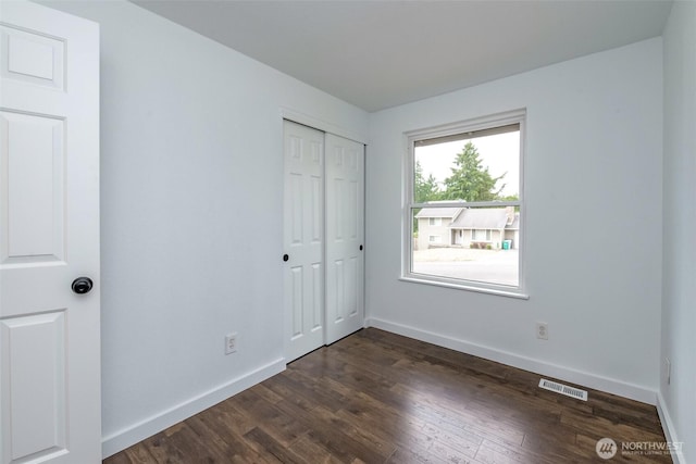 13457 SE Fairwood Blvd, Renton, WA 98058 - unfurnished bedroom with dark wood-style flooring and a closet