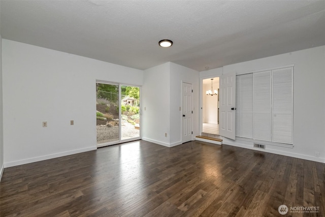 13457 SE Fairwood Blvd, Renton, WA 98058 - unfurnished living room featuring a chandelier and dark wood-style flooring