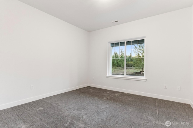 14317 Mima Rd SW, Olympia, WA 98512 - spare room featuring baseboards and dark colored carpet