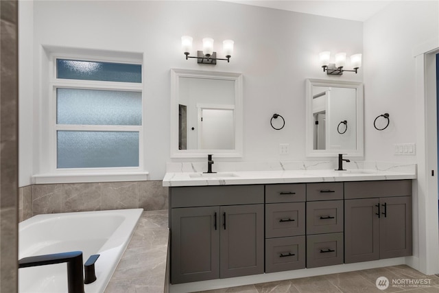 14317 Mima Rd SW, Olympia, WA 98512 - bathroom with double vanity, a bath, and healthy amount of natural light