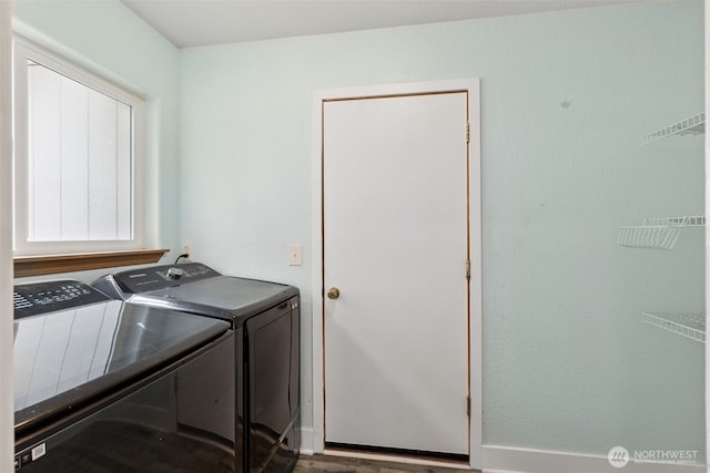 22415 Bluewater Dr SE, Yelm, WA 98597 - laundry room with washer and dryer and wood finished floors