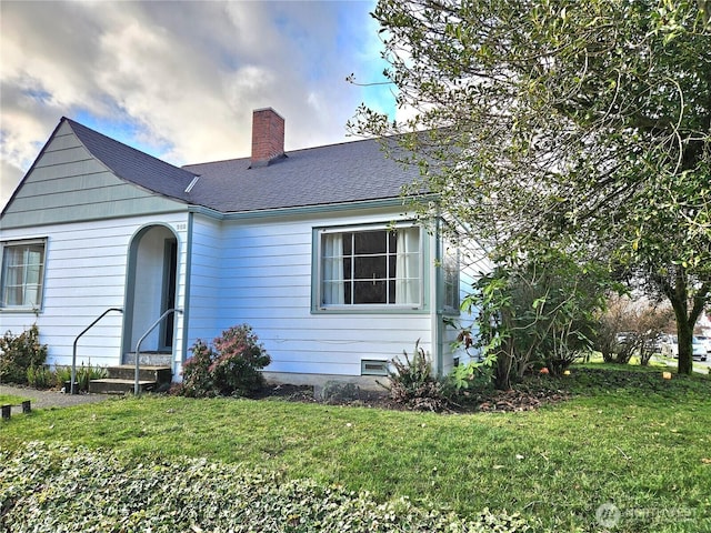 302 S Albert St, Port Angeles, WA 98362 - view of front of property featuring a chimney, a front yard, entry steps, and a shingled roof