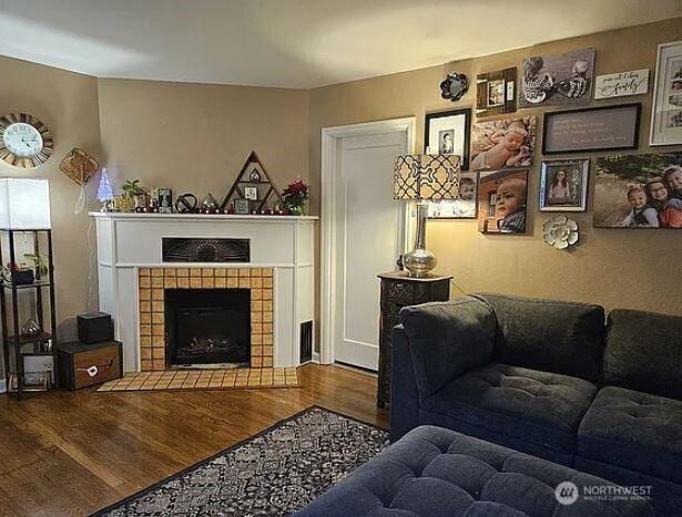 302 S Albert St, Port Angeles, WA 98362 - living room with wood finished floors and a tile fireplace