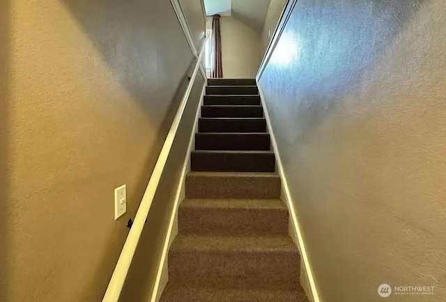 302 S Albert St, Port Angeles, WA 98362 - stairway featuring a textured wall and carpet floors