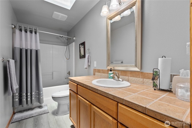 8615 176th St NW, Stanwood, WA 98282 - bathroom featuring vanity, shower / bath combo with shower curtain, and wood finished floors