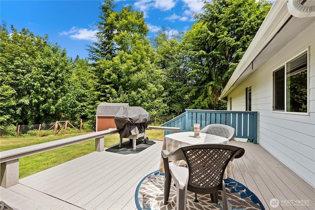 8615 176th St NW, Stanwood, WA 98282 - deck with a shed, outdoor dining space, and a grill