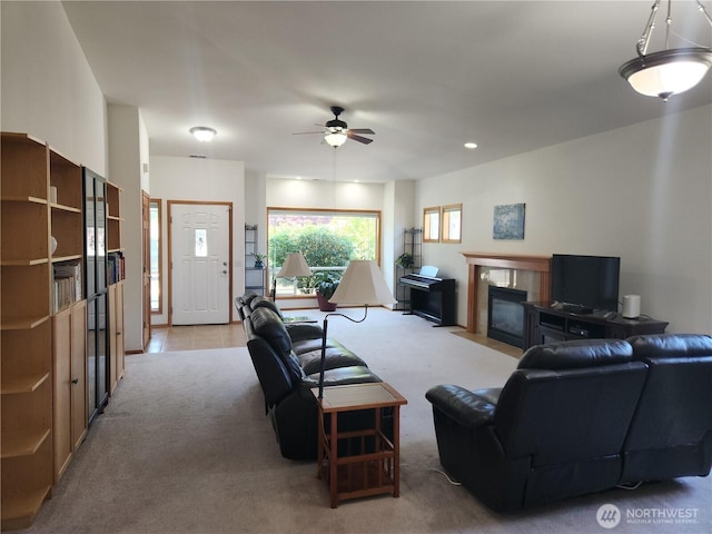 16314 2nd Dr SE, Bothell, WA 98012 - living area featuring light colored carpet, a tile fireplace, and ceiling fan