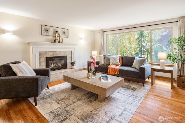 822 206th Ave NE, Sammamish, WA 98074 - living area with light wood finished floors and a fireplace