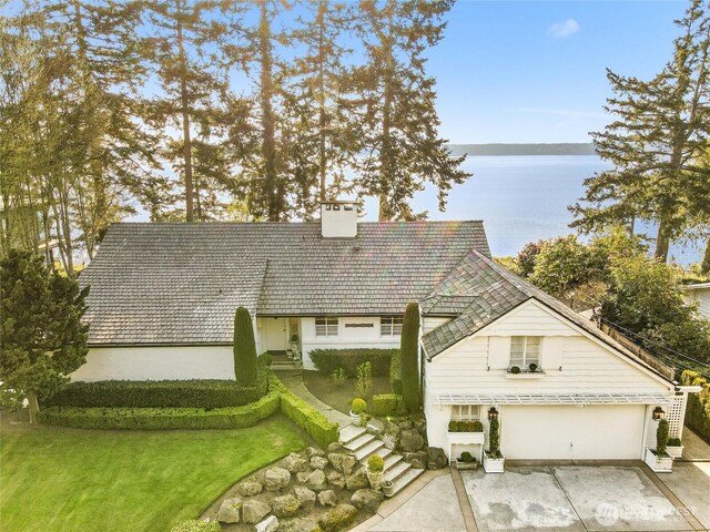 19263 Edgecliff Dr SW, Normandy Park, WA 98166 - view of front of property featuring a chimney, a patio area, and a water view