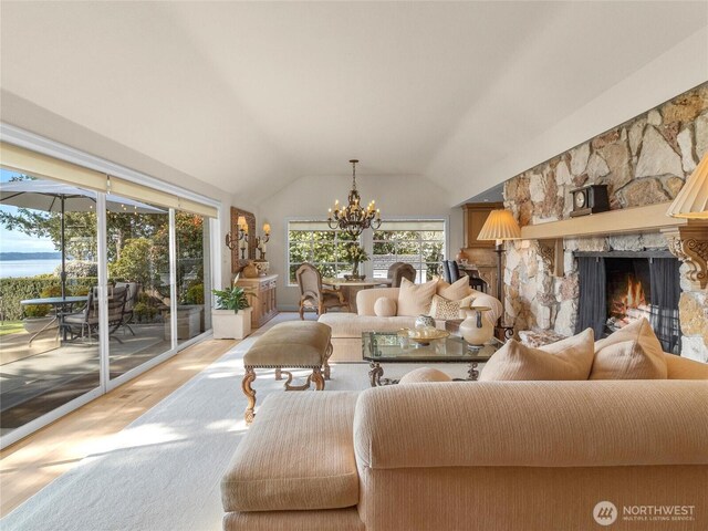 19263 Edgecliff Dr SW, Normandy Park, WA 98166 - living area with a fireplace, a chandelier, wood finished floors, and lofted ceiling