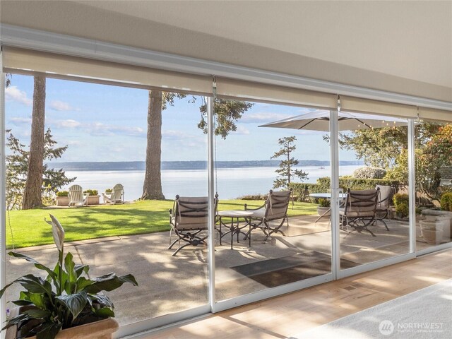 19263 Edgecliff Dr SW, Normandy Park, WA 98166 - doorway to outside featuring a water view and wood finished floors