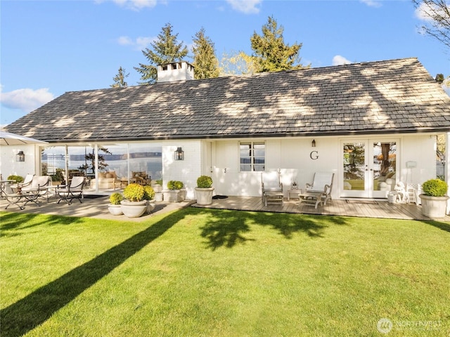 19263 Edgecliff Dr SW, Normandy Park, WA 98166 - rear view of property featuring french doors, a chimney, a lawn, and a wooden deck