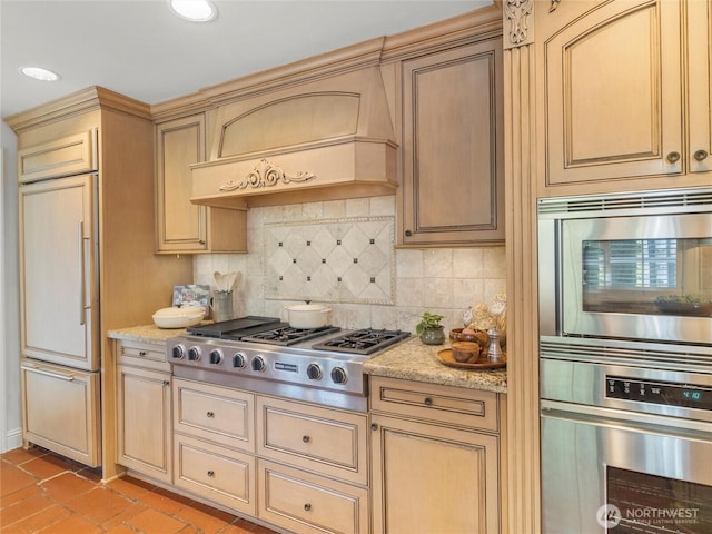 19263 Edgecliff Dr SW, Normandy Park, WA 98166 - kitchen with appliances with stainless steel finishes, backsplash, light stone counters, custom exhaust hood, and recessed lighting