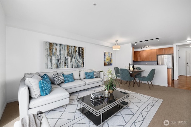 124 Bellevue Ave E Unit 504, Seattle, WA 98102 - living area with rail lighting and light colored carpet