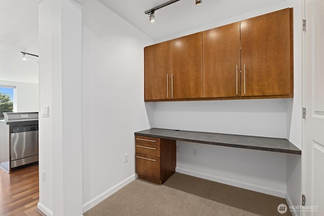 124 Bellevue Ave E Unit 504, Seattle, WA 98102 - unfurnished office featuring rail lighting, built in desk, and vaulted ceiling