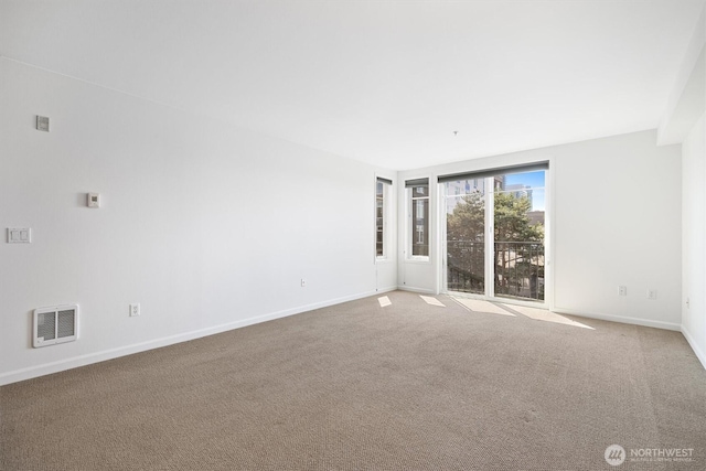 124 Bellevue Ave E Unit 504, Seattle, WA 98102 - carpeted spare room with baseboards