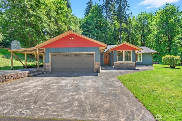 132 Tanglewood Dr, Longview, WA 98632 - view of front facade featuring an attached garage, stone siding, asphalt driveway, and a front lawn