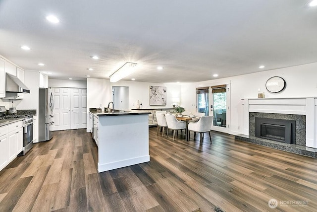 20 Cascade Ky, Bellevue, WA 98006 - kitchen featuring stainless steel appliances, recessed lighting, under cabinet range hood, dark countertops, and dark wood-style floors