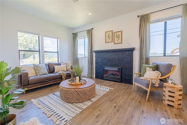 5502 Chuckanut Dr, Bow, WA 98232 - living room featuring wood finished floors, a fireplace, and recessed lighting