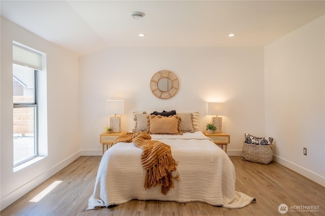 5502 Chuckanut Dr, Bow, WA 98232 - bedroom with multiple windows, light wood-type flooring, and vaulted ceiling