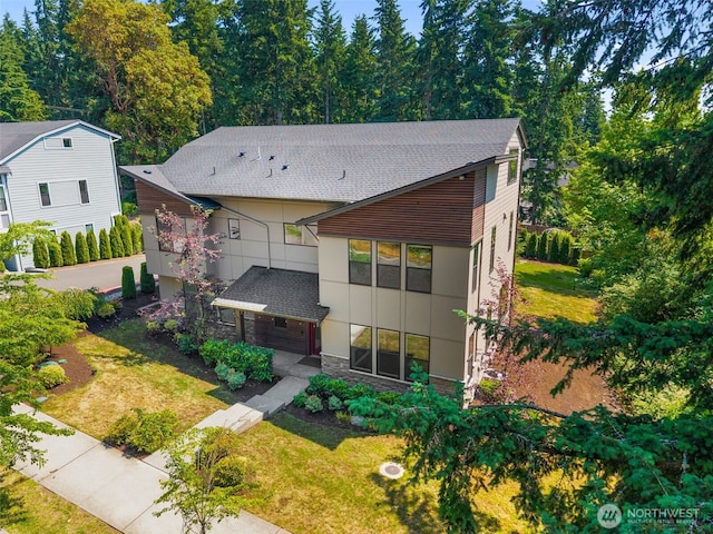 587 155th Pl NE, Bellevue, WA 98007 - contemporary house featuring roof with shingles, stone siding, a front lawn, and stucco siding