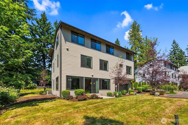 587 155th Pl NE, Bellevue, WA 98007 - back of property with a yard and an attached garage