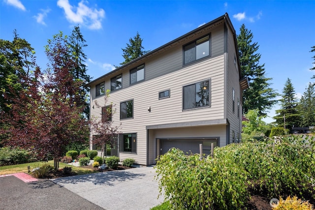 587 155th Pl NE, Bellevue, WA 98007 - view of front of home with a garage and concrete driveway